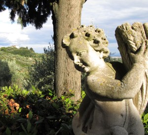 The cherub statue in the gardens at the Villa del Cielo with Caminetto 